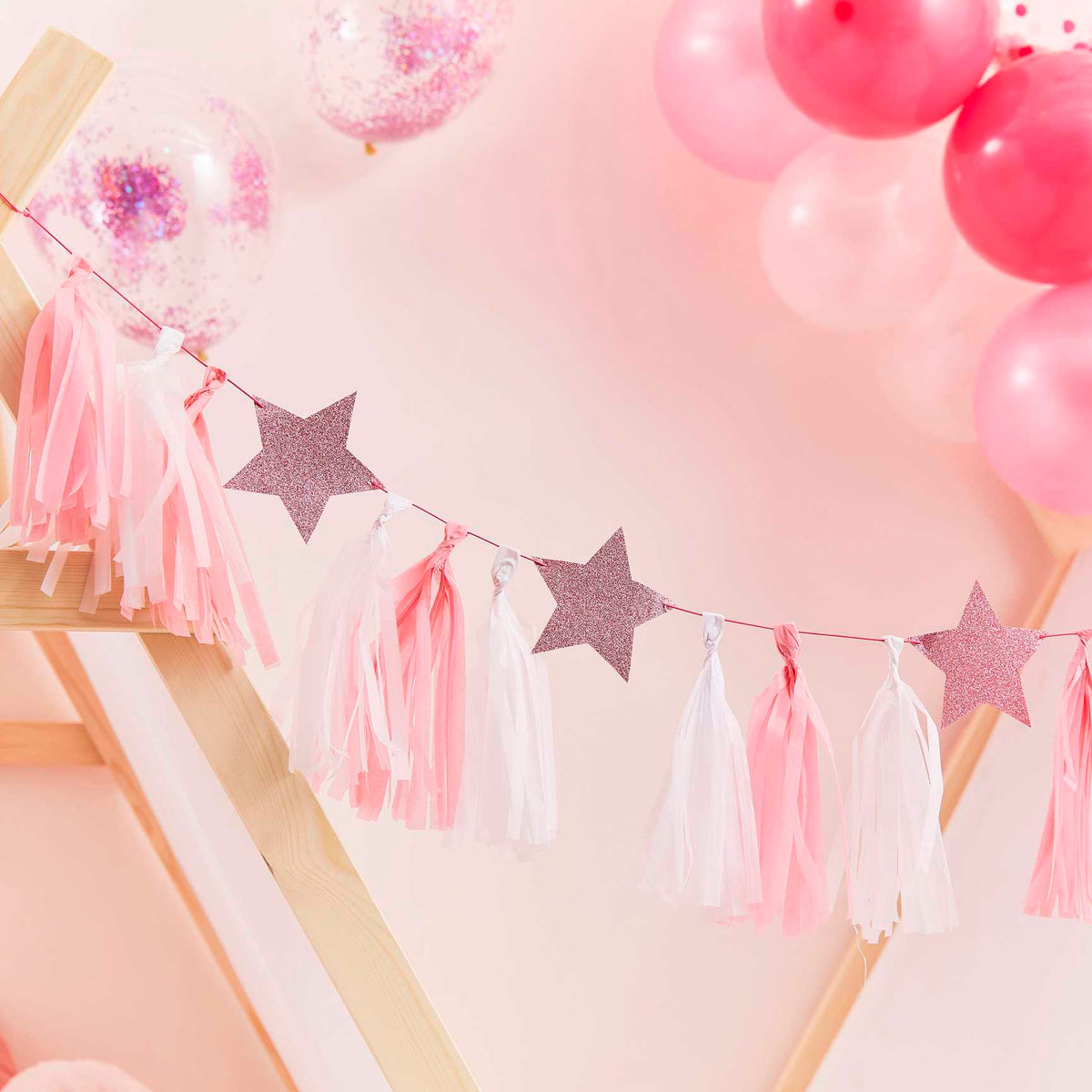 Pink and white pom-poms with stars
