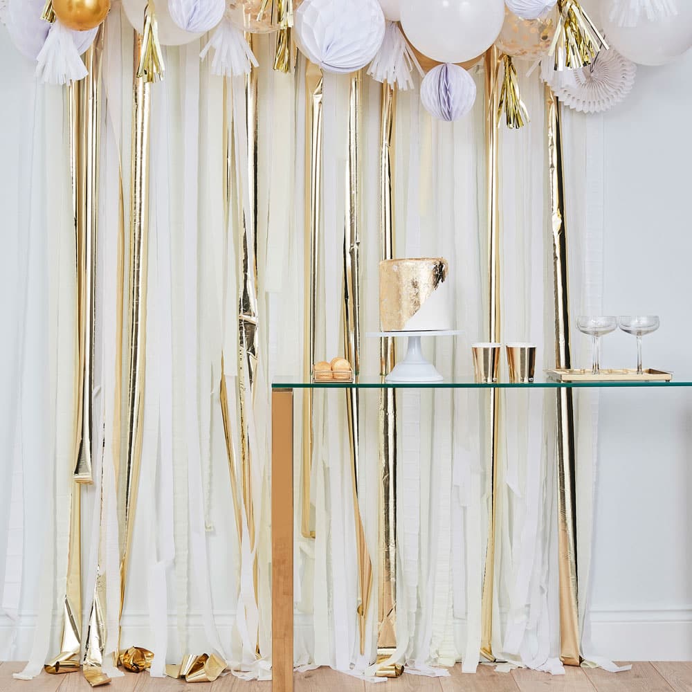 Crepe paper background in cream white and gold